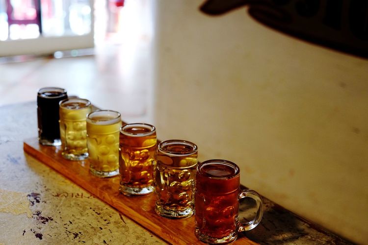 Close-up of wine glasses on table