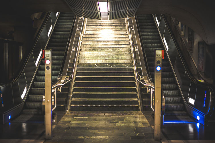 Illuminated escalators at subway station