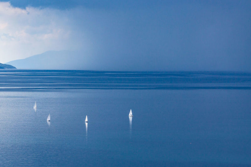 Scenic view of sea against blue sky