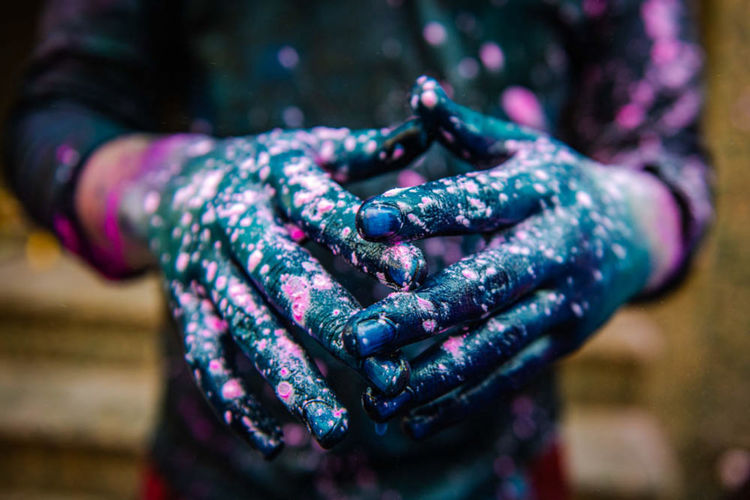 Midsection of woman with with paint outdoors