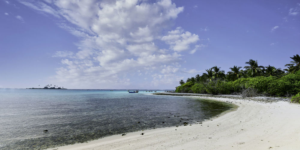 Scenic view of beach against sky