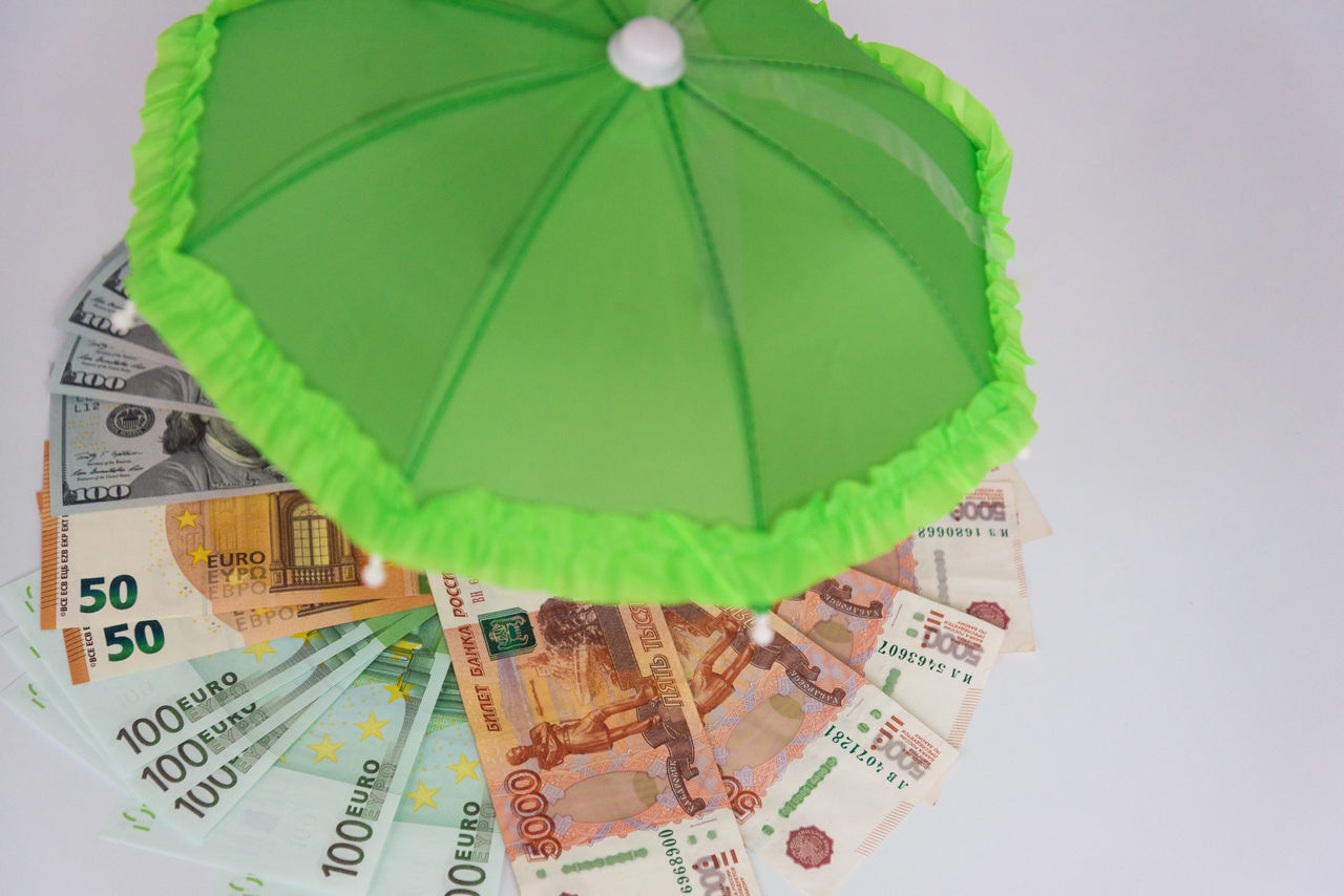 paper currency, currency, green, finance, umbrella, business, wealth, studio shot, no people, protection