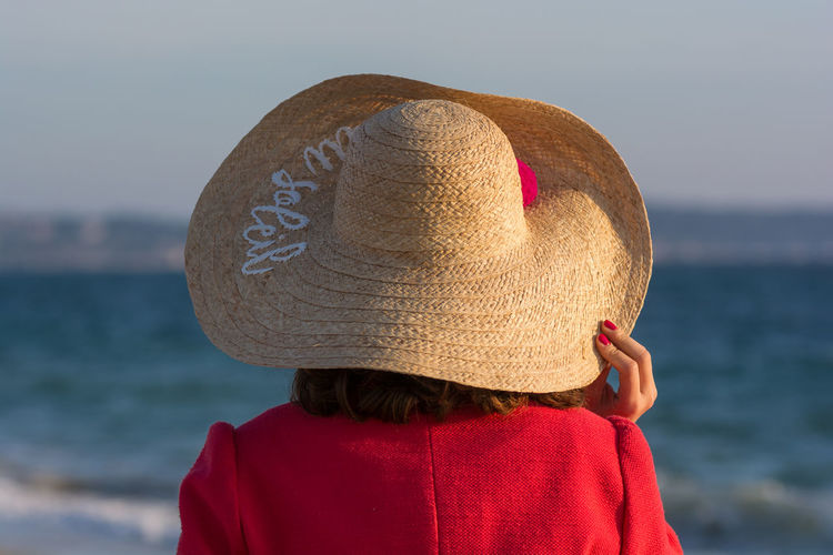 Rear view of woman wearing sun hat