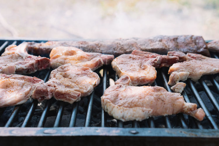 Close-up of pork meat on barbecue grill