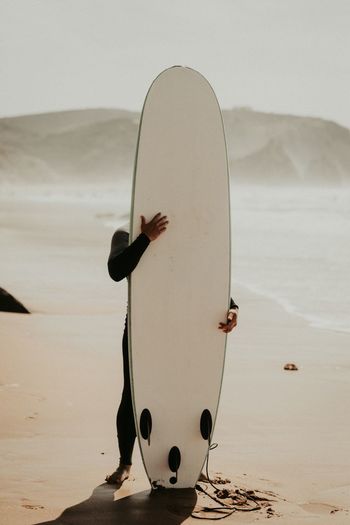 Tight hugs! | Sigma 50mm f/1.4 EyeEm Selects Sand Nature Water Beach Day Outdoors Real People Sky Sea Beauty In Nature Bird Surf Surfing Surf's Up Surfer Surf Photography Surfboard Surfers Surfers Paradise Ocean Only Men Full Length Sport Weekend Activities Lost In The Landscape Fresh on Market 2017 Second Acts The Still Life Photographer - 2018 EyeEm Awards The Traveler - 2018 EyeEm Awards Summer Sports