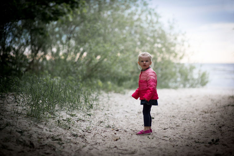 Girl standing at beach