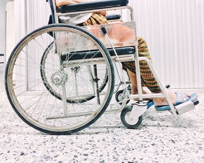 Low section of person on wheelchair