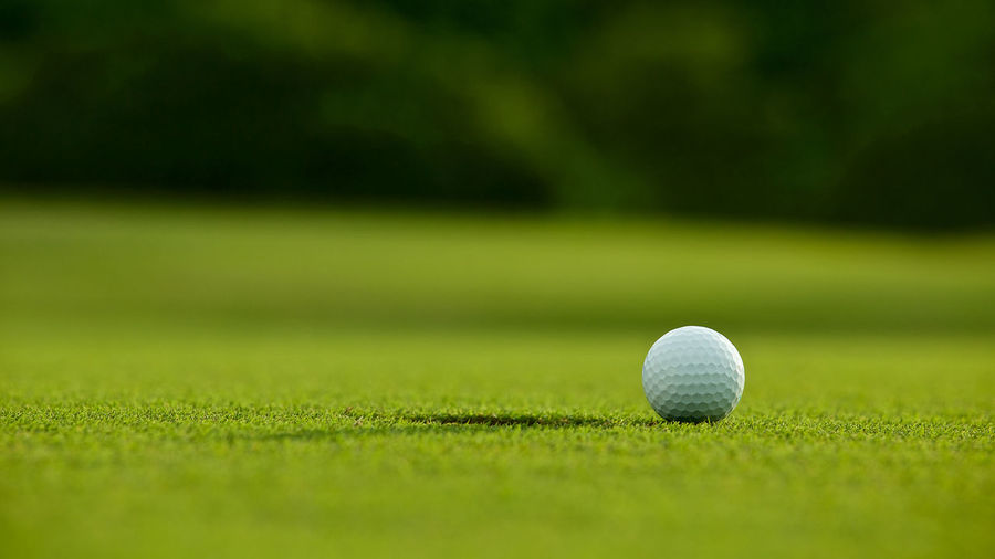 Close-up of golf ball on grass