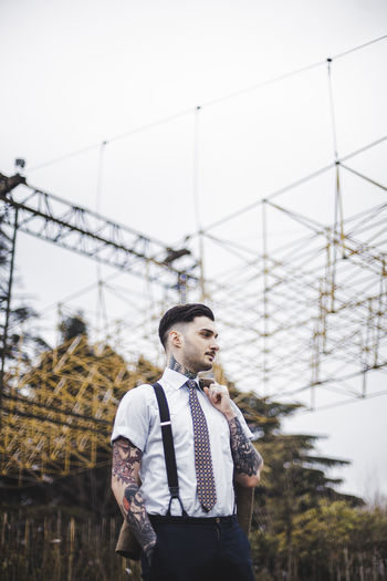 #EyeEmNewHere Architecture Bike Boy Clear Sky Costume Day Leisure Activity Lifestyles One Person Outdoors Real People Sky Standing Tattoo Young Adult EyeEmNewHere Summer Exploratorium Summer Road Tripping