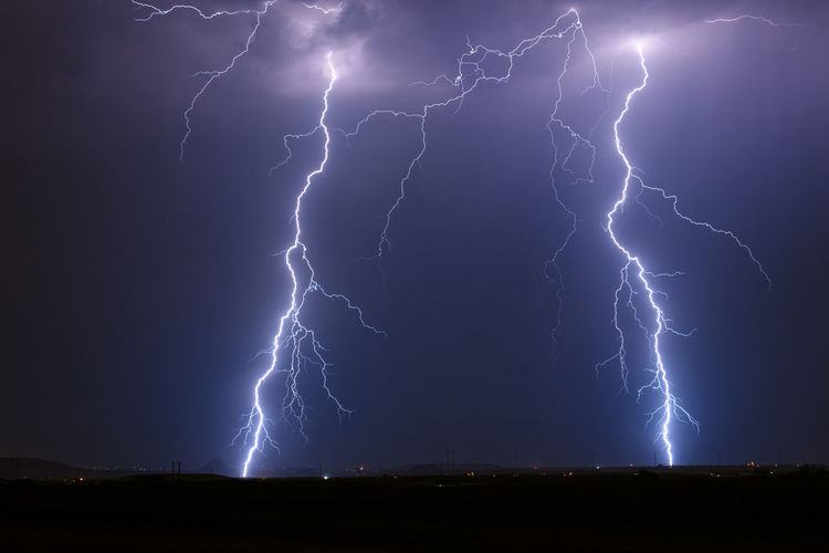Lightning bolts strike from a powerful storm near florence, arizona.