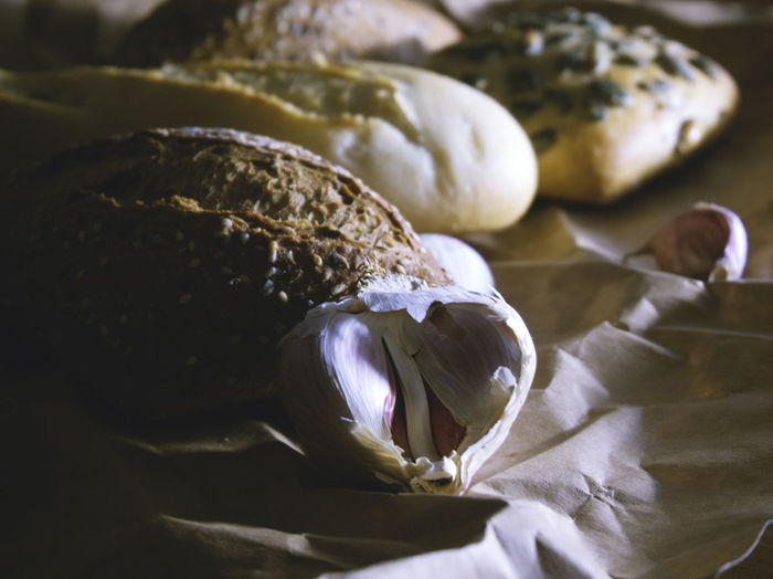 Close-up of bread and garlic on table