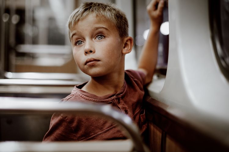 Thoughtful boy traveling in bus