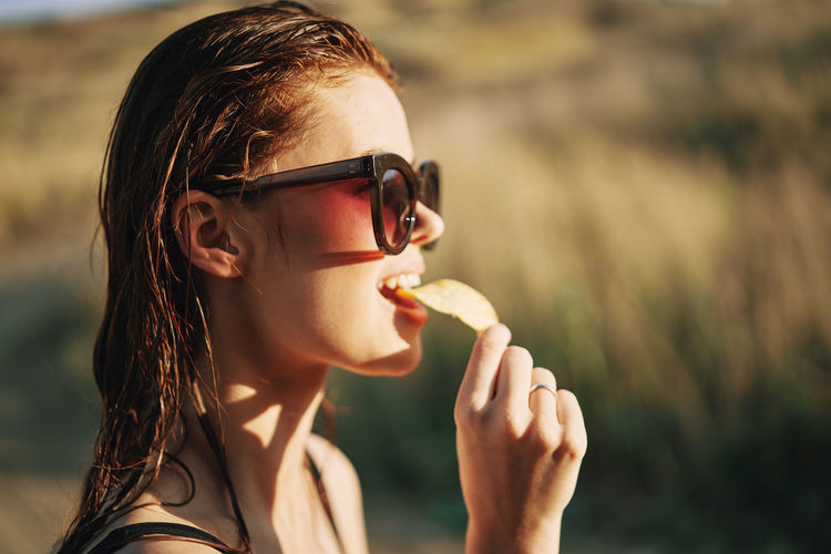 Portrait of young woman wearing sunglasses