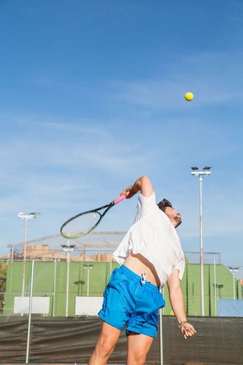Man playing with ball in background