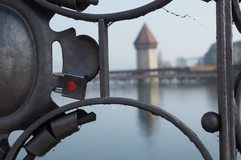 Close-up of love lock on bridge