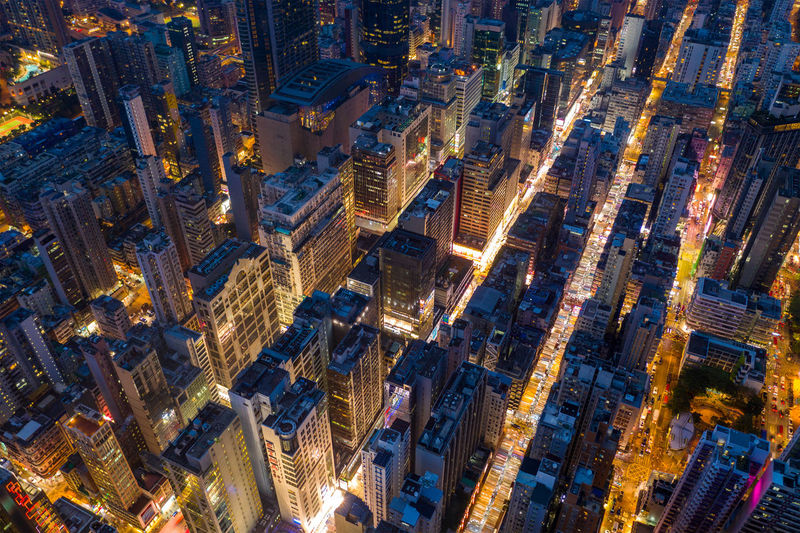 Aerial view of illuminated buildings in city at night