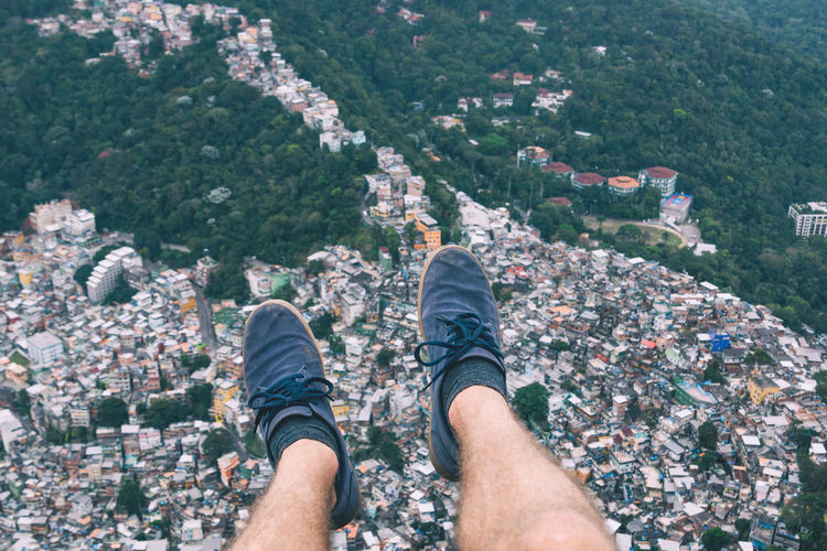 Low section of man's legs above city