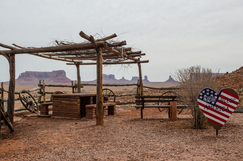 Scenic point on the monument valley against sky with an american flag in a heart