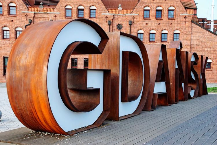 Famous big iron letters against red brick building in city of gdansk, poland 
