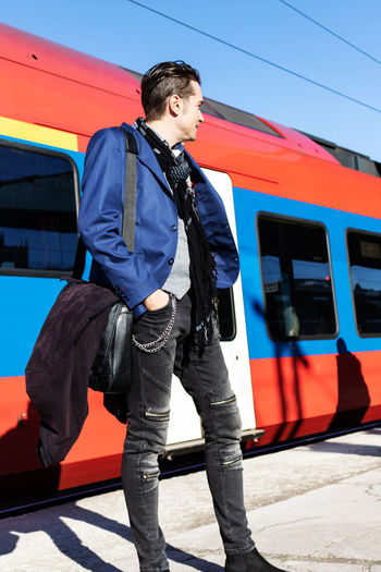 Full length of man standing on train