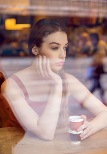 Portrait of woman sitting in restaurant