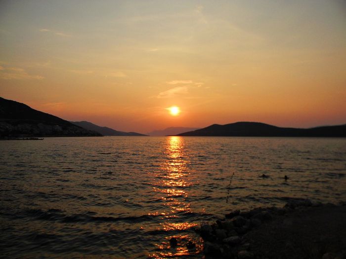 Scenic view of sea at sunset