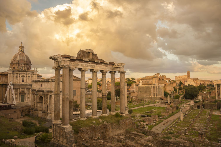 The roman forum during a cloudy sunset