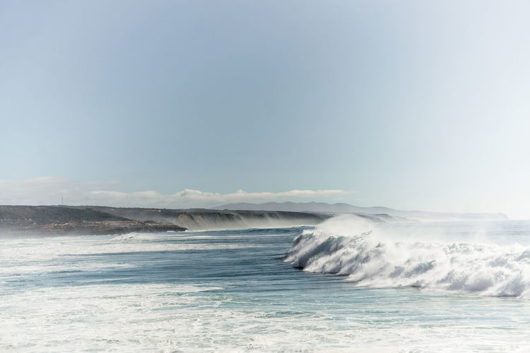 Scenic view of sea against clear sky