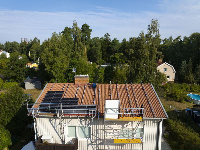 Men installing solar panels on roof