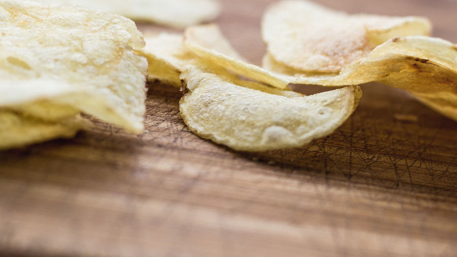 Close-up of potato chips on table