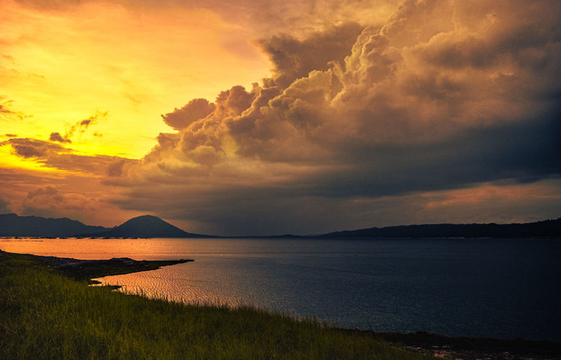 Scenic view of sea against dramatic sky