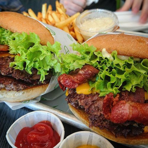 Close-up of bacon cheeseburger in tray