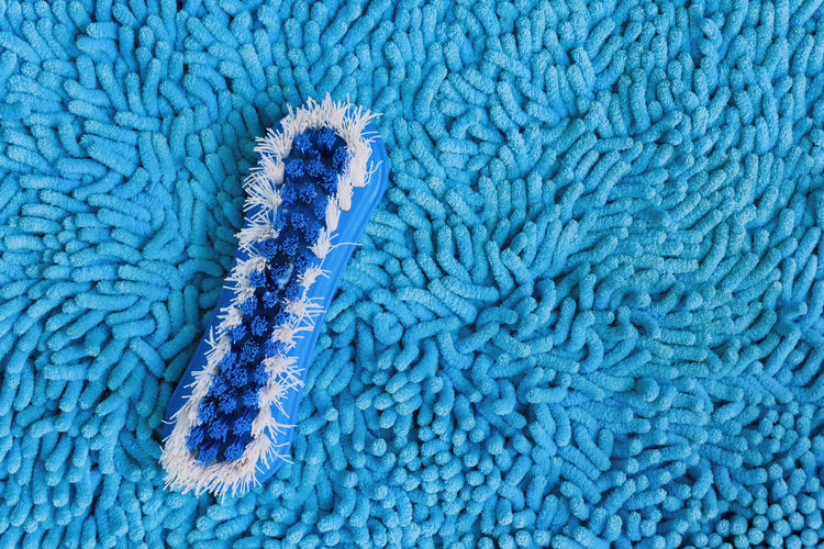 High angle view of brush on rug