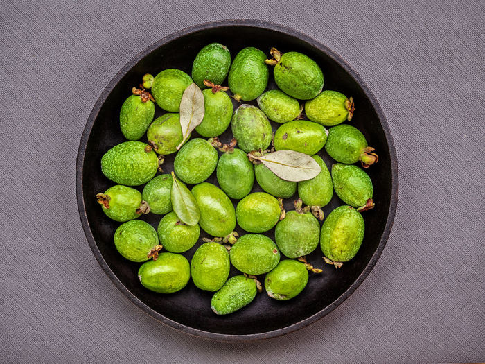 High angle view of green fruits in bowl