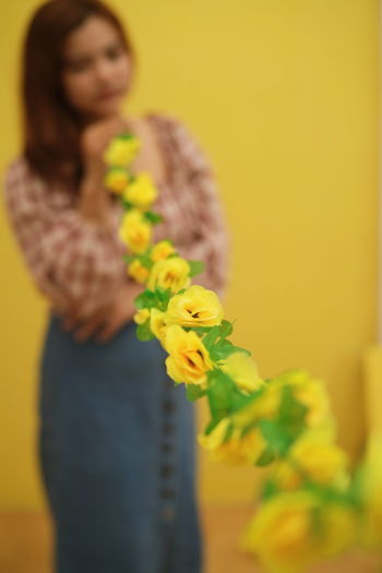 Close-up of woman holding flower bouquet