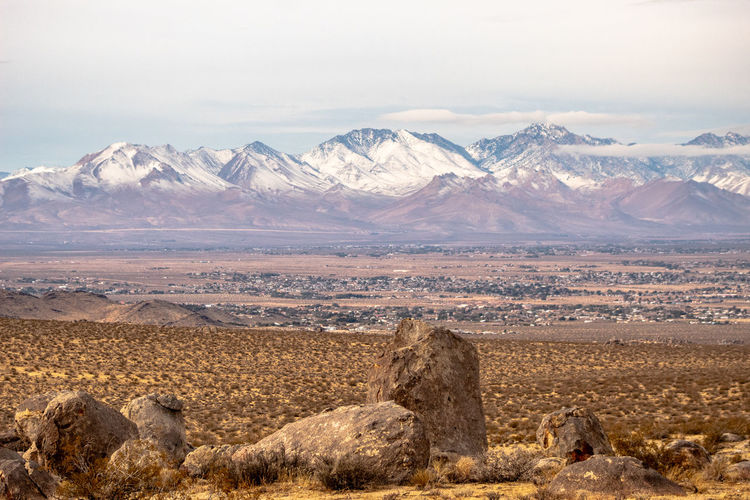 Scenic view of snowcapped mountains against sky in mojave desert