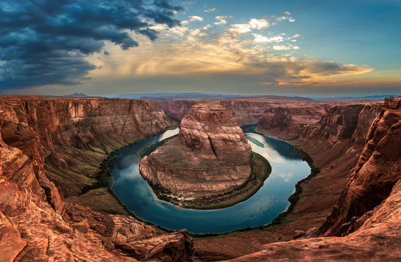 High angle view of horseshoe bend against sky during sunset