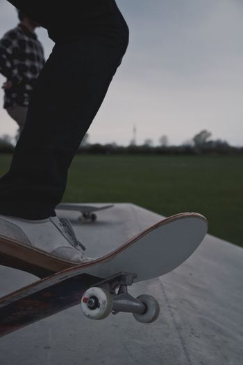 Low section of man skateboarding on skateboard