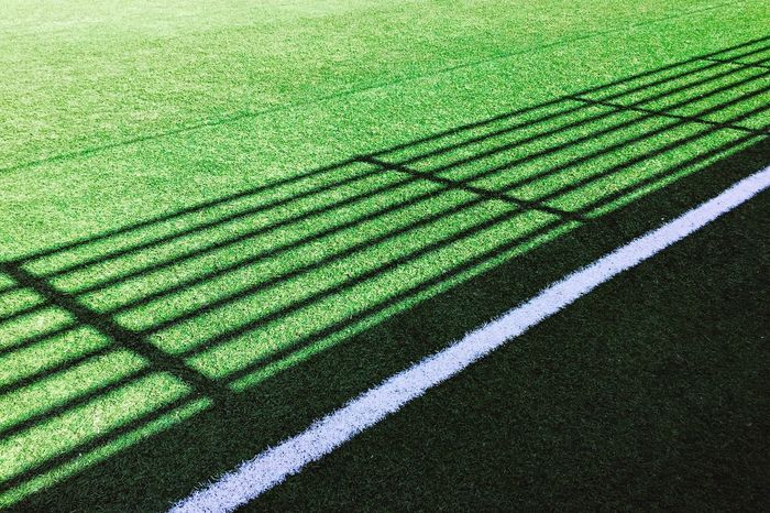 High angle view of shadow pattern on playing field