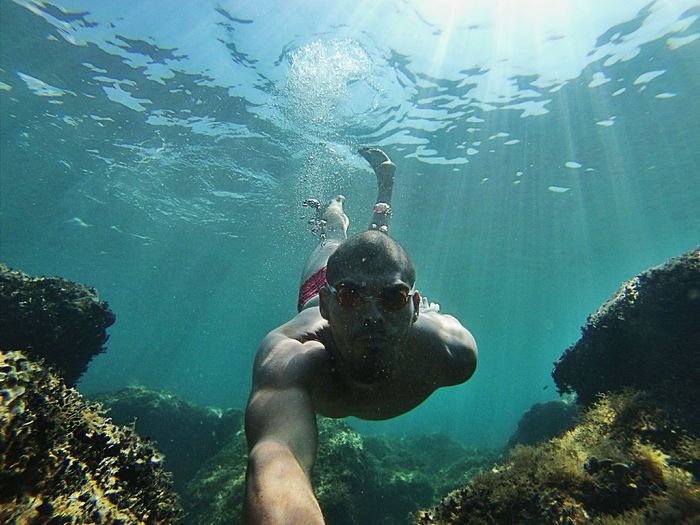 Portrait of young man scuba diving in sea