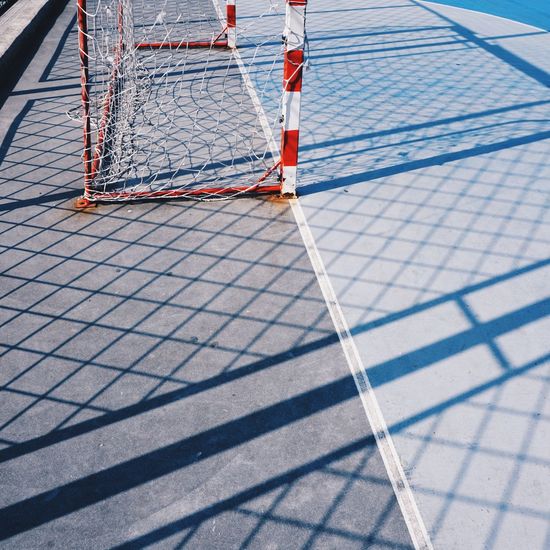 Soccer goal and rope net in the field in the street