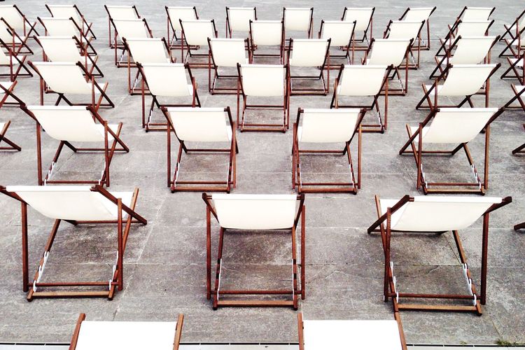 High angle view of empty chairs in rows