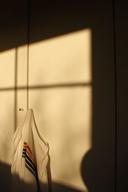 CLOSE-UP OF CLOTHES HANGING ON METAL WALL