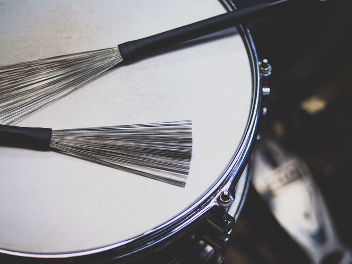 Close-up of broom on drum