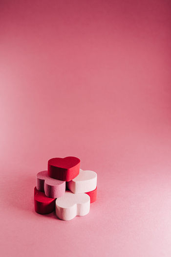 Close-up of pink stack against colored background