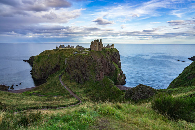 Dunnottar castle by sea on cliff