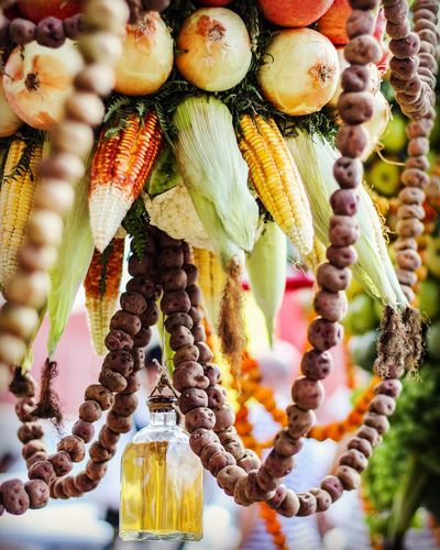 Close-up of vegetables hanging for sale at market