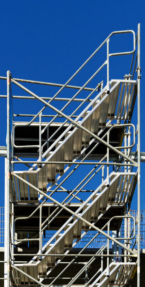 Stairs to nothing, steel staircase construction on a building site, abstract