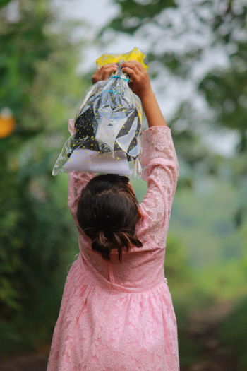 Cropped hand holding flower