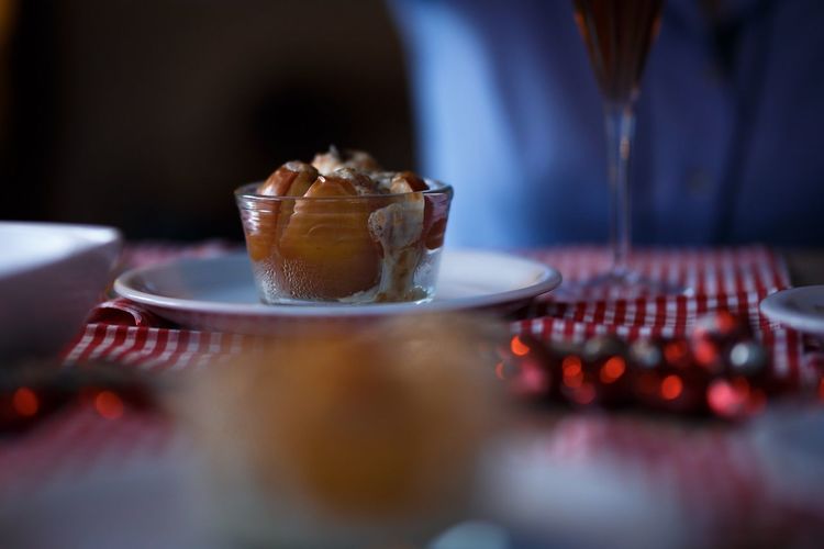 Close-up of baked christmas apple in plate on table